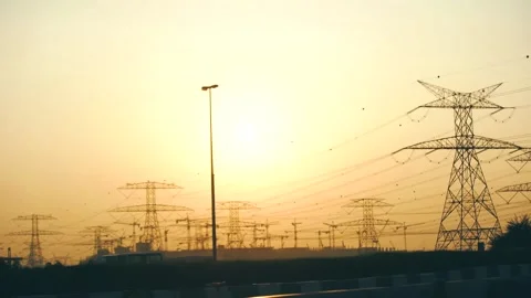 High voltage electrical lines at sunset. Distribution and supply of electricity. Stock Footage 137830123