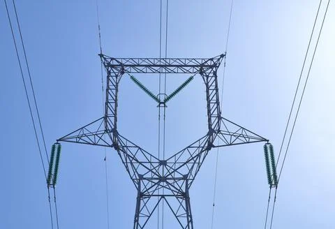 High voltage electrical power distribution turret over clear sky Stock Photos