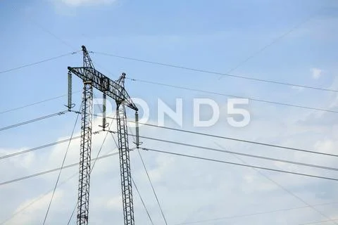 High Voltage Electrical Pylon Against Clear Blue Sky Stock Photos