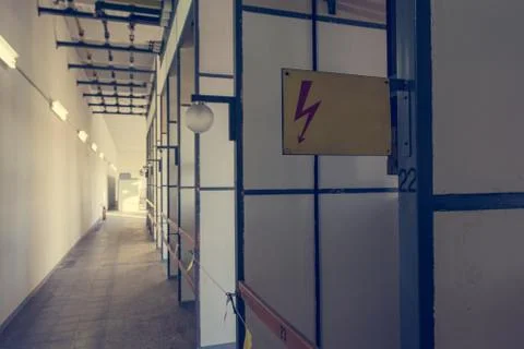 High voltage electrical shock hazard sign in a power plant. Stock Photos