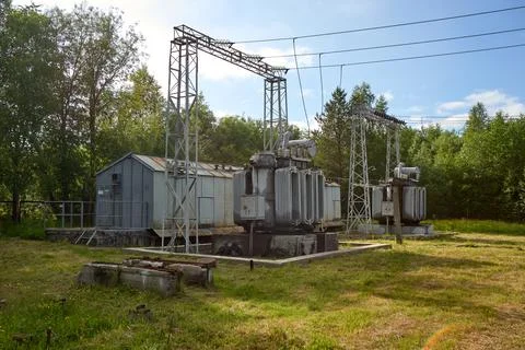 High-voltage electrical substation against the blue sky Stock Photos