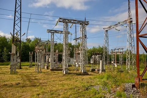 High-voltage electrical substation against the blue sky Stock Photos