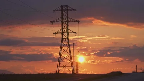High-voltage electrical support on the background of amazing gorgeous sunset Stock Footage 105534755