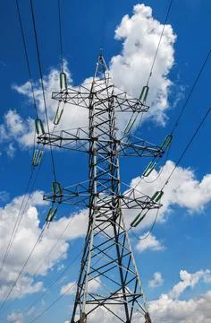 High voltage electrical support on cloudy blue sky background Stock Photos
