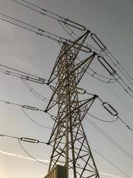 High voltage electrical tower with blue sky background Stock Photos