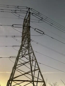 High voltage electrical tower with blue sky background Stock Photos