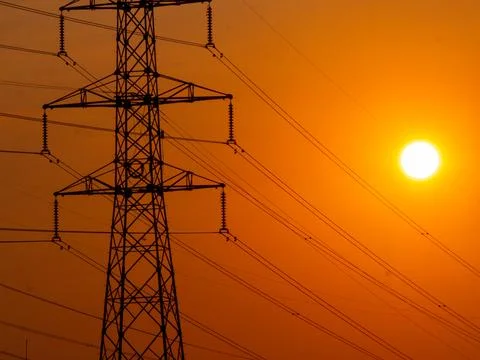 High voltage electrical tower during sunset Stock Photos