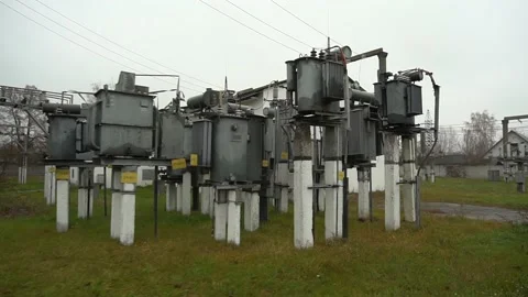 High-voltage electrical transmission grids against a neutral sky Stock Footage 165243772