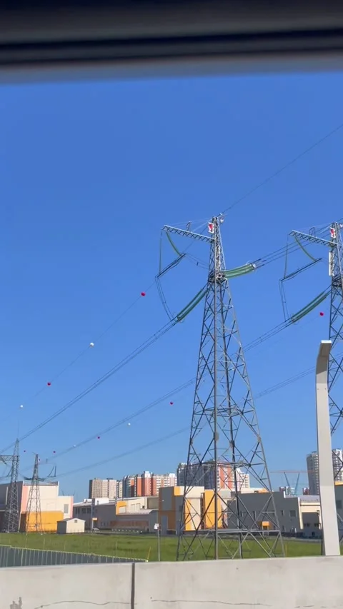 High voltage electrical transmission tower with power lines and safety spheres. Stock Footage 339432226