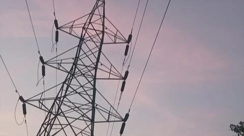 High Voltage Electrical Transmission Tower at Sunset Stock Photos
