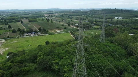 High-voltage electricity pole installing in tropical forest and mountain areas Stock Footage 208237629