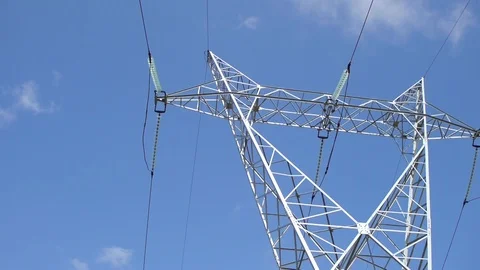High Voltage Electricity Pylon in blue sky and motion on the camera. Stock Footage 94471968