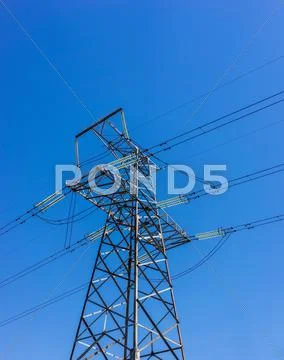 High Voltage Electricity Pylon System On The Sky Background