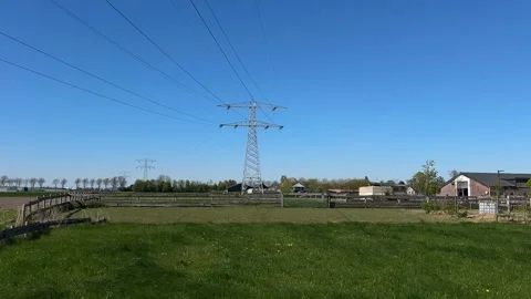 High Voltage Electricity Pylons and Power Lines Across Rural Landscape Near Stock-Footage 343006830