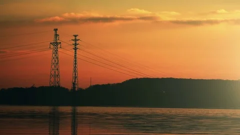High Voltage Electricity Pylons at Sunset Stock Footage 73411904