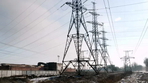 High voltage electricity tower and power lines in the industrial zone Stock Footage 150651675