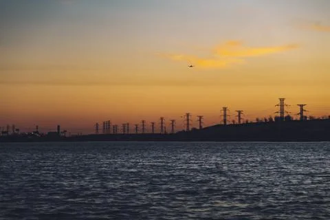 High voltage electricity tower sky sunset landscape, industrial background with Stock Photos