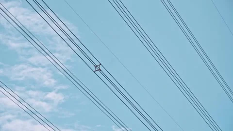 High voltage electricity wires high in the blue sky Video stock 278314261