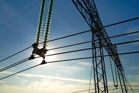 High voltage insulation string on steel pillar with electric power lines for Stock Photos