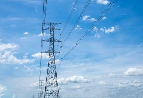 High voltage lamp post on a background of sky and clouds. Stock Photos