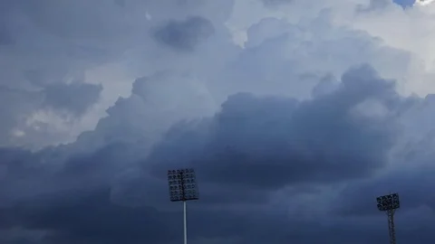 High Voltage Light Bulb on Time lapse of storm clouds moving fast, Stock-Footage 77292741