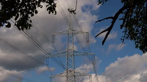 A high voltage line in front of a blue sky 4k 25fps video Stock Footage 279814045