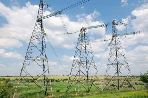 High-voltage line passing through the field Stock Photos