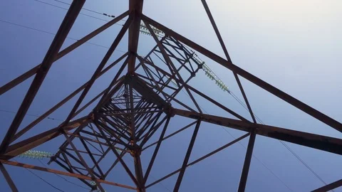 High voltage line pylon seen from below with blue sky Stock Footage 101837372