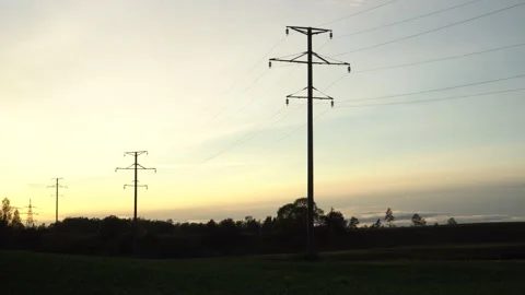 The high voltage line on the sunset back... | Stock Video | Pond5