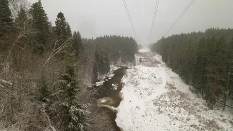 High voltage line through the forest in winter 動画素材 103547365