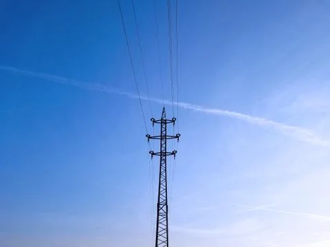 High-voltage lines and cables onthe blue sky background Stock Photos