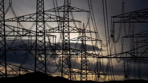 High Voltage Lines and Pylons, Time Lapse at Sunrise with Dark Silhouette Stock Footage 122368492
