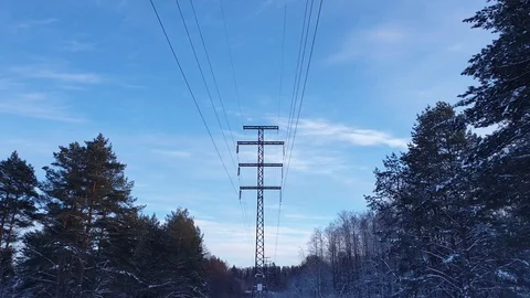 High voltage lines in the forest. Power lines in the winter forest Stock Footage 101612951