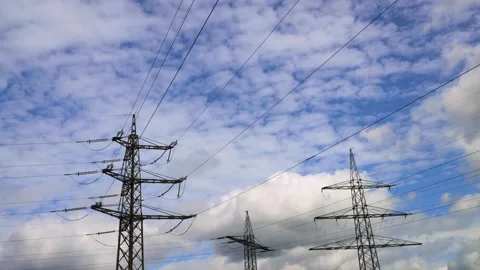 High voltage lines in front of clouds 4k 30fps time lapse video Stock Footage 272508504