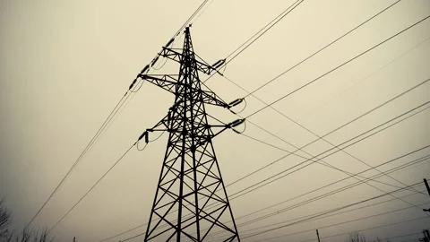 High-voltage lines. Tower with electrical wires against the background of a gray Stock Footage 230207550