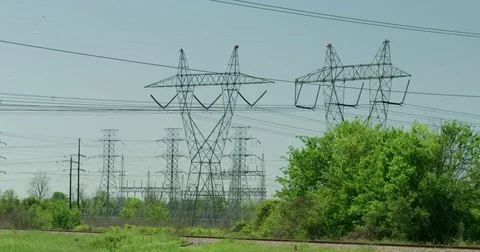 High voltage overhead power line infrastructure used in electric power tilt down Stock Footage 74629817