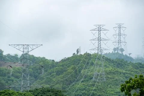 High voltage pole and line cable electrical transmission energy supply to ind Stock Photos