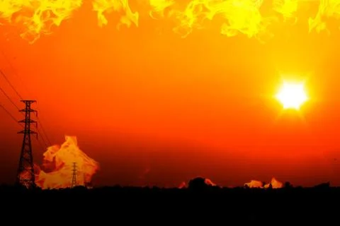 High voltage pole with a flame burning sunset Stock Photos