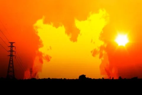 High voltage pole with a flame burning sunset Stock Photos
