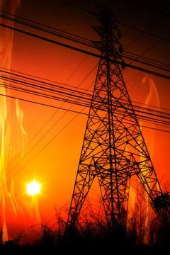 High voltage pole with a flame burning sunset Stock Photos