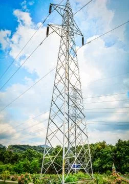 High voltage pole on the Moutain with tree and cloud Sky background / high vo Stock Photos