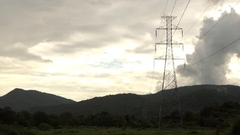 High Voltage Pole moving clouds mountain in the evening. 4k Accelerate time 動画素材 93069875