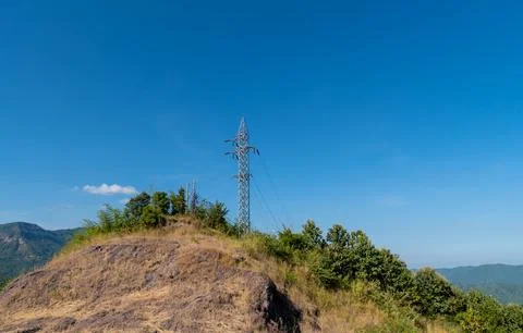 ?High voltage pole stand alone on the top of the mountain Stock Photos