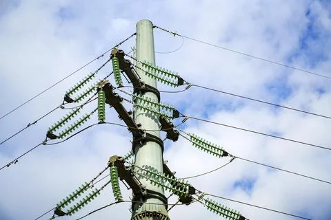 High-voltage pole for transferring large amounts of energy against a cloudy s Stock Photos
