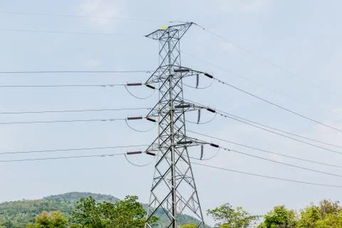 High voltage pole in valley Stock Photos