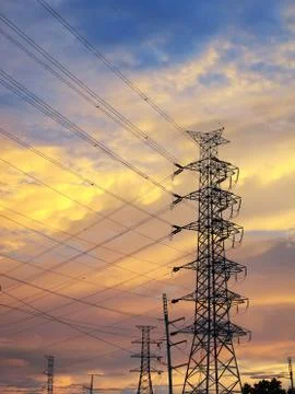 High voltage poles silhouette Stock Photos
