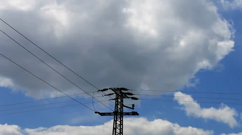 High Voltage Post against blue sky and clouds Stock Footage 38938179