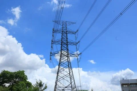 High voltage post with blue sky. Stock Photos