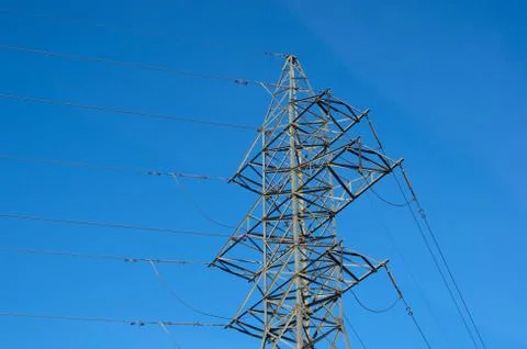 High voltage post. High-voltage tower sky background. Stock Photos