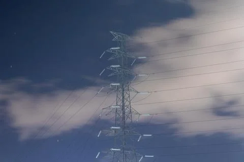 High voltage post. High-voltage tower sky background. Electricity distribution Stock Photos